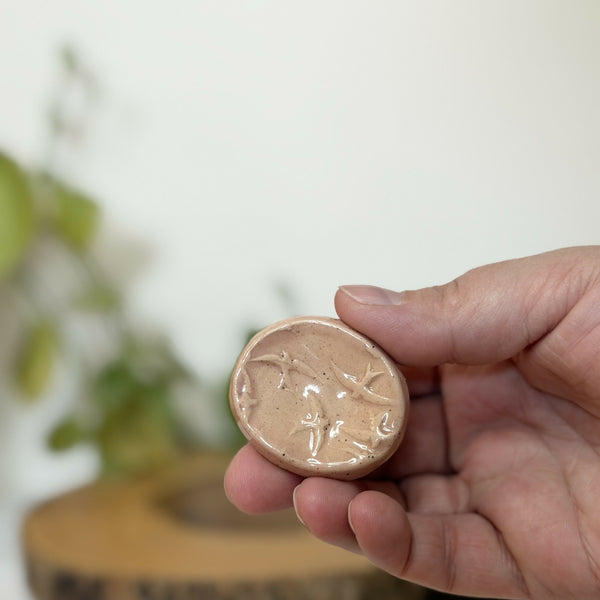 Pink bird patterned calming stone