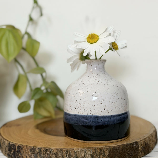 White and black speckled pottery bud vase