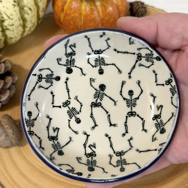 Skeleton patterned ring dish with purple rim