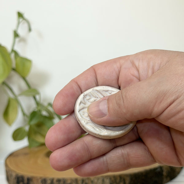 White leaf patterned calming stone