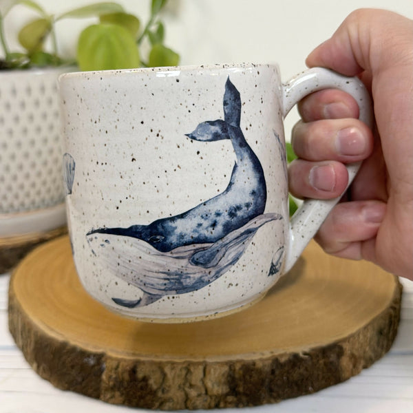White speckled mug with whales 16oz.