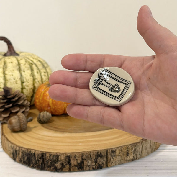Skeleton peace sign Calming stone with pink rim