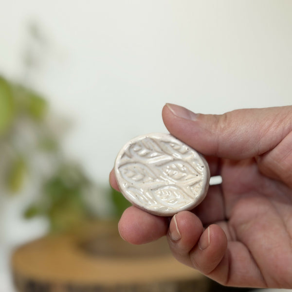 White leaf patterned calming stone