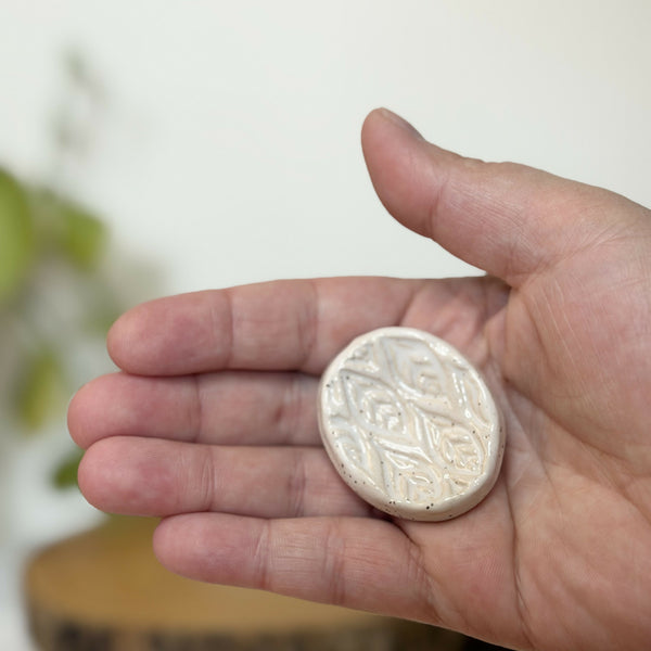 White leaf patterned calming stone