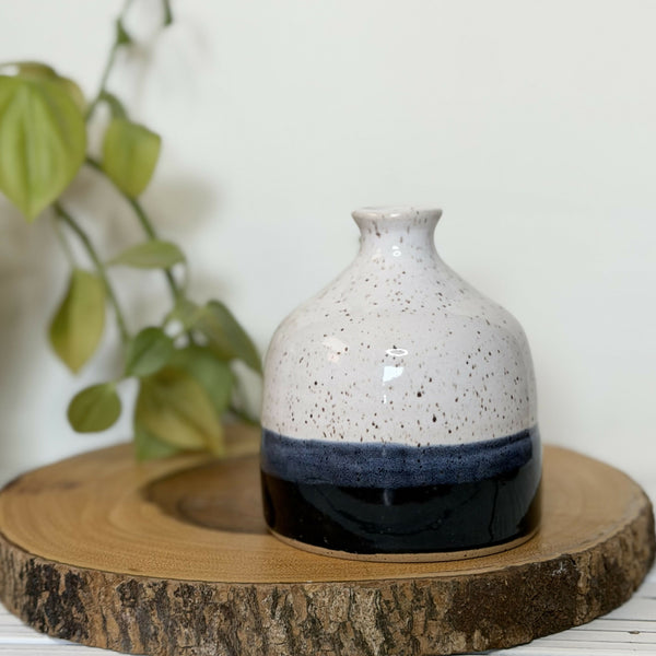 White and black speckled pottery bud vase