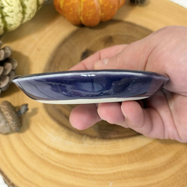 Skeleton patterned ring dish with purple rim